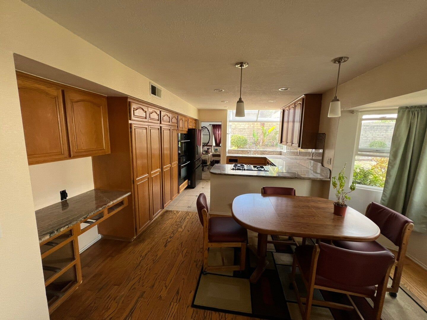 Kitchen cabinet refacing from honey oak to white, before