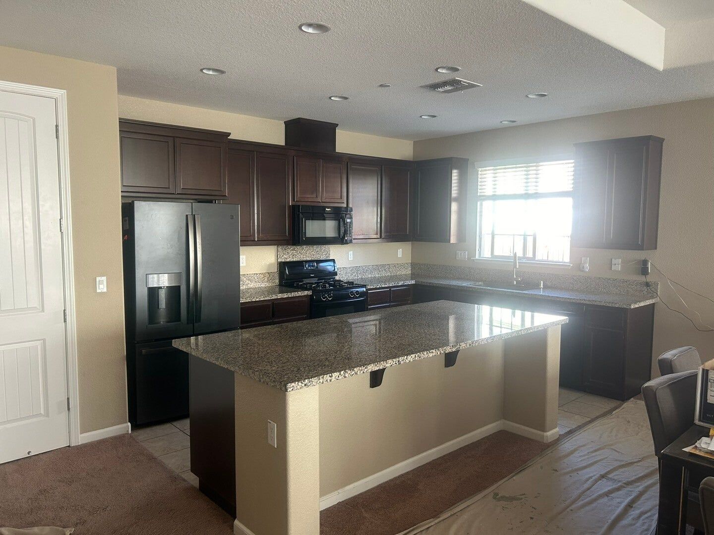 Dark kitchen cabinets refaced in light gray, before