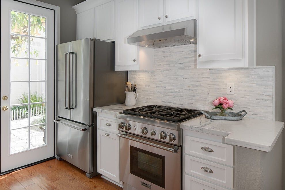 Refaced white kitchen cabinets